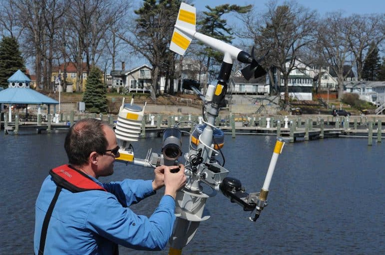 Greg Cutrell of LimnoTech working on buoy deployment in South Haven, Michigan