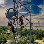 Tower climbers installing wireless networks