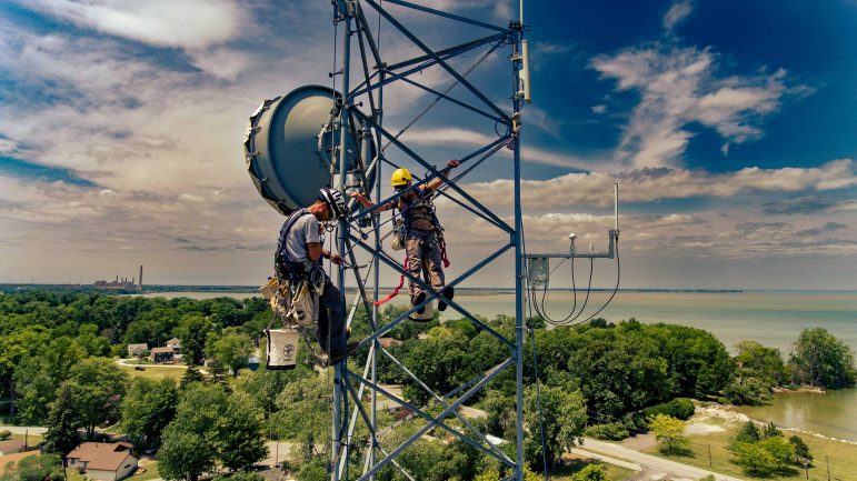 Tower climbers installing wireless networks