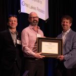 Ed Verhamme (right) was presented with the Anderson-Everett Award award by Neil Rooney, IAGLR President (middle) and Jerome Marty, IAGLR Executive Director (left) during the IAGLR 2023 conference (photo credit: Stephany Hildebrand).