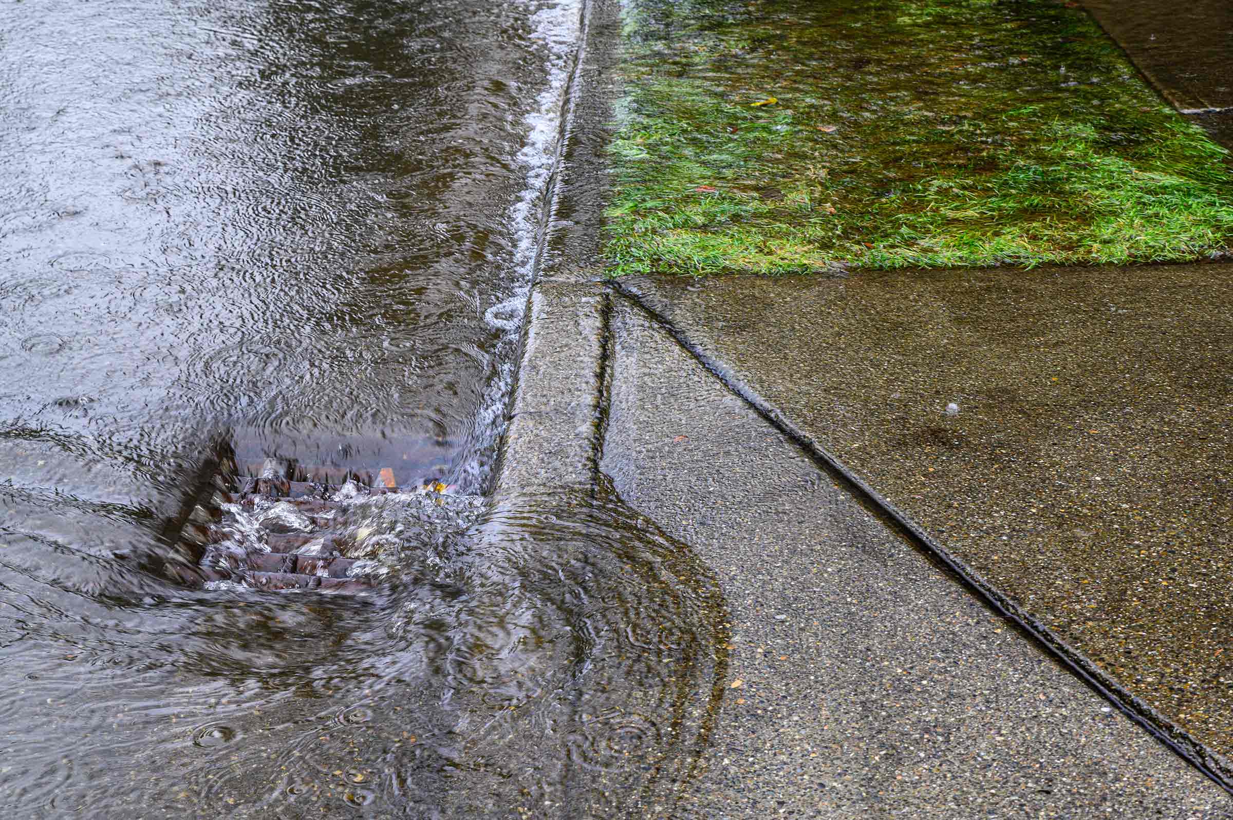 Stormwater rushing down a storm drain from a big rain and flooding event.