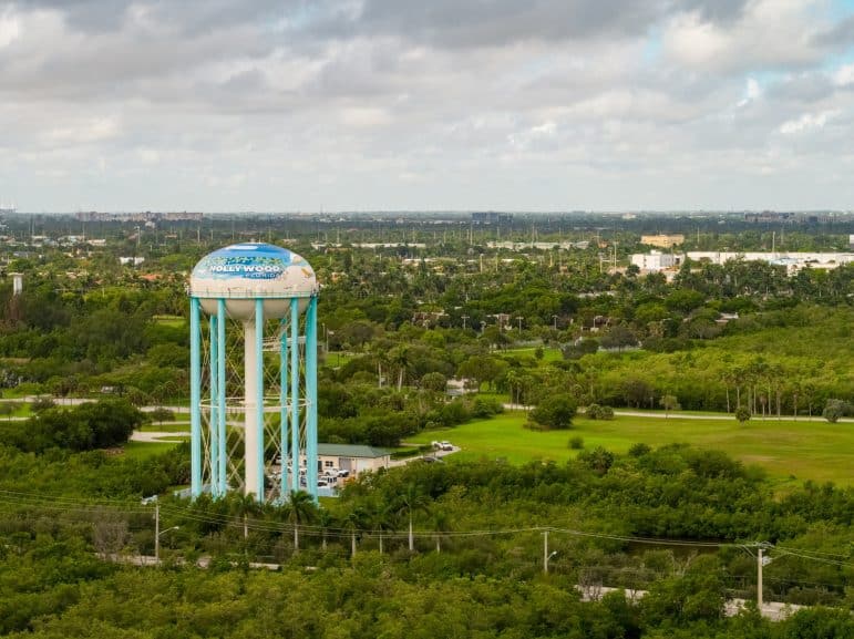 Image of a water tower outside of a city.