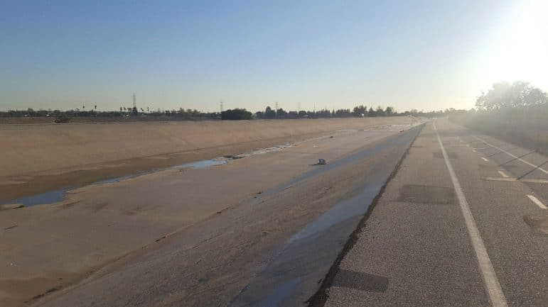 Verdugo Wash flood control channel showing a concrete-lined channel with small ponds of water.